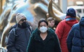 A woman wearing a face mask walks on a street in Manhattan of New York, the United States. Photo by Xinhua/Wang Ying.