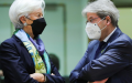 European Central Bank (ECB) President Christine Lagarde (L) speaks with European Commissioner for Economy Paolo Gentiloni while attending a meeting of the Eurogroup in Brussels. Photo by Xinhua.