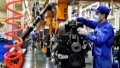 A worker works at a production workshop in Nanjing. Photo by Xinhua/Ji Chunpeng.