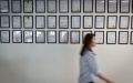 A staff member walks past a patent wall at the headquarters of Royole Technology Co., Ltd in Shenzhen, south China's Guangdong Province. Photo by Xinhua/Mao Siqian. 