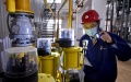 A technician checking a gas heating device in Fengtai District in Beijing. Photo by Xinhua/Li Xin.