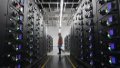 A worker maintains equipment at China Mobile's data center in a cloud computing base in Zhongwei City, northwest China's Ningxia Hui Autonomous Region. Photo by Xinhua/Wang Peng.