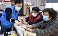 A volunteer helps seniors use an online payment app at a community in Fengtai District, Beijing, capital of China. Photo by Xinhua/Li Xin.