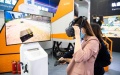 A woman tries a VR device at China International Rail Transit and Equipment Manufacturing Industry Exposition in Zhuzhou, central China's Hunan Province. Photo by Xinhua/Chen Sihan.