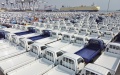 The  vehicles to be loaded onto a freight ship at Yantai Port, east China's Shandong Province. Photo by Tang Ke/Xinhua.