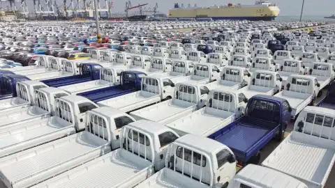 The  vehicles to be loaded onto a freight ship at Yantai Port, east China's Shandong Province. Photo by Tang Ke/Xinhua.