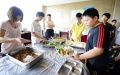 Children have lunch during a fitness summer camp in Wuhan, capital of central China's Hubei Province. Photo by Xinhua/Hao Tongqian.
