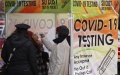 A health worker takes a COVID-19 test from a local resident in New York, USA. Photo by Xinhua.