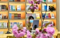 A woman reading on an electronic device in a library in Rizhao City, east China's Shandong Province. Photo by Xinhua/Guo Xulei.