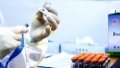 A medical worker prepares a dose of COVID-19 vaccine at a vaccination site in Beijing, capital of China. Photo by Xinhua/Zhang Yuwei.
