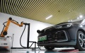 An electric vehicle gets charged up via a robot at a charging station in Xiong'an New Area, north China's Hebei Province. Photo by Xinhua/Zhu Xudong.