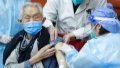 A medical worker injects COVID-19 vaccine for a senior citizen in Dongcheng District of Beijing, capital of China. Photo by Xinhua/Ju Huanzong.