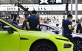 Visitors view cars from XPeng Motors during China (Tianjin) Auto Show. Photo by Xinhua/Li Ran.