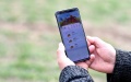 A worker uses a mobile phone to check the condition of water and fertilizer in the fields at an "unmanned farm" in Zhaoqiao Town. Photo by Xinhua/Liu Junxi.