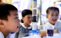 A student observes a wastewater treatment experiment in Baohe District of Hefei City, east China's Anhui Province. Photo by Xinhua/Liu Junxi.