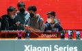 People look at a Xiaomi cellphone during the Mobile World Congress in Barcelona, Spain. Photo by Xinhua/Zheng Huansong.