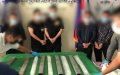 An undated photo shows the suspects and drugs nabbed by the Chinese and Cambodian police in a large-scale cross-border drug trafficking case. Photo by Xinhua. 