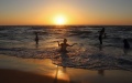 Children enjoy themselves during the hot weather in the Mediterranean Sea. Photo by Rizek Abdeljawad/Xinhua.