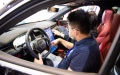 A visitor experiences an intelligent car at the World Computing Conference in Changsha, central China's Hunan Province. Photo by Xinhua/Chen Sihan.