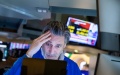 A trader works at the New York Stock Exchange (NYSE) in New York, the United States. Photo by Michael Nagle/Xinhua.