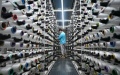 A worker is seen at a textile factory in Shishi City of Quanzhou, southeast China's Fujian Province. Photo by Zhou Yi/Xinhua.