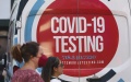 Pedestrians walk past a COVID-19 testing site on Times Square in New York, the United States. Photo by  Xinhua/Wang Ying.