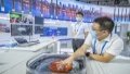 A staff member shows a high-intensity focused ultrasound system for cancer treatment. Photo by Xinhua/Huang Wei.
