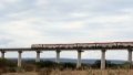 A passenger train runs on the Tsavo River Super Major Bridge near the Tsavo National Park in Kenya. Photo by Xinhua/Dong Jianghui.