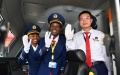 Female train driver Concilia (C), Alice (L) and Chinese instructor Tu Zhuxin gesture before the operation of the standard gauge railway (SGR) in Mombasa, Kenya. Photo by Xinhua/Sun Ruibo.