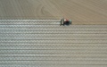 A seeding machine guided by the BeiDou Navigation Satellite System working in a cotton field in northwest China's Xinjiang Uygur Autonomous Region. Photo by Xinhua/Ding Lei.