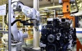 Robotic arms assemble engines on an assembly line at a workshop of the Weichai Power Co., Ltd. in Weifang City, east China's Shandong Province. Photo by Xinhua/Guo Xulei.