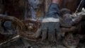 A worker catches a rusty chain at a ship breaking yard in Cilincing of Jakarta, Indonesia.Photo by Xinhua/Agung Kuncahya B.