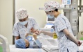 Medical workers encourage a 4-year-old child diagnosed with spinal muscular atrophy after the injection of Spinraza at a hospital in Zaozhuang, east China's Shandong Province. Photo by Xinhua/Guo Xulei.