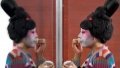 A dancer puts on makeup at Zhengzhou Song and Dance Theater in Zhengzhou, central China's Henan Province. Photo by Xinhua/Li Jianan.