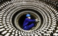 A worker works at a factory of Harbin Electric Machinery Company Ltd. of Harbin Electric Corporation in Harbin, northeast China's Heilongjiang Province. Photo by Xinhua/Wang Song.