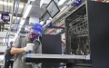 A worker is seen at the production line of a dishwasher interconnected factory of Chongqing Haier Washing Electric Appliances Co., Ltd. in southwest China's Chongqing. Photo by Xinhua/Wang Quanchao.