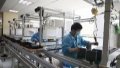 Staff members work at a workshop in an industry park in Qingpu District of Shanghai, east China. Photo by Xinhua/Zhao Yihe.