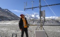 A scientific research member checks an Ozone flux unit at the Mount Qomolangma base camp.  Photo by Xinhua/Jiang Fan.