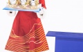 A staff member wearing garment with traditional Chinese decorative element is seen at a medal ceremony of the Beijing 2022 Olympic Winter Games in Beijing, capital of China. Photo by Xinhua/Wu Zhuang.
