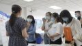 Students learn about recruiting information at a campus job fair in Southwest University in southwest China's Chongqing. Photo by Qin Tingfu/Xinhua.