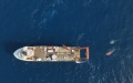 The deep-sea manned submersible Shenhai Yongshi (Deep Sea Warrior) and its mother ship Tansuo-2. Photo by Xinhua/Zhang Liyun.