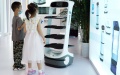 Children look at a meal service robot at the World Robot Conference (WRC) 2022 in Beijing, capital of China. Photo by Xinhua/Ren Chao.