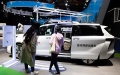 Visitors view a self-driving taxi of Japanese carmaker Toyota at the automobile exhibition area of the fifth China International Import Expo (CIIE) at the National Exhibition and Convention Center (Shanghai). Photo by Xinhua/Jin Liwang.