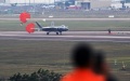 A J-20 stealth fighter jet touches down after a training for the upcoming 14th Airshow China in Zhuhai, south China's Guangdong Province. Photo by Yu Hongchun/Xinhua.