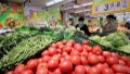 People shop at a supermarket in Zaozhuang City, east China's Shandong Province. Photo by Sun Zhongzhe/Xinhua.