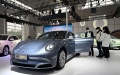Visitors view a vehicle at the booth of ORA, a sub-brand of Chinese automaker Great Wall Motors during the China Motor Show (Tianjin). Photo by Xinhua/Zhao Zishuo.