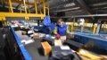 A staff member sorts packages at a logistics center in Taiyuan, north China's Shanxi Province. Photo by Xinhua/Yang Chenguang.