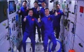 The Shenzhou-15 and Shenzhou-14 crew waving after a historic gathering in space. Photo by Xinhua/Guo Zhongzheng.