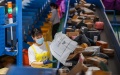 A staff member distributes parcels at the workshop of a logistics company in Lanshan County of Yongzhou City, central China's Hunan Province. Photo by Peng Hua/Xinhua.