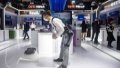 A staff member of China Electronic Technology Group Corporation (CETC) demonstrates a wearable exoskeleton robot during the Light of Internet Expo in Wuzhen, east China's Zhejiang Province. Photo by Xinhua/Jiang Han.